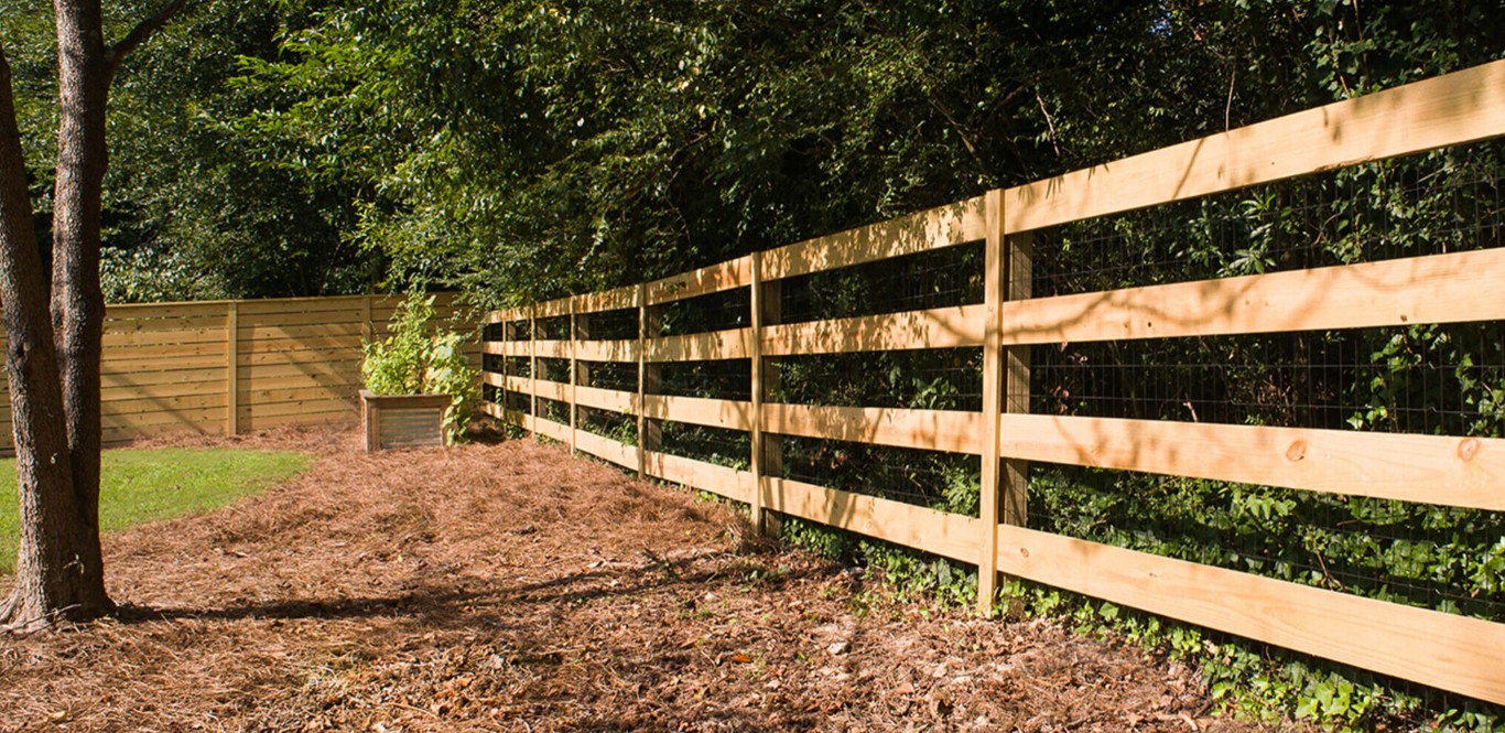 Durable wood split-rail fence installation in natural setting